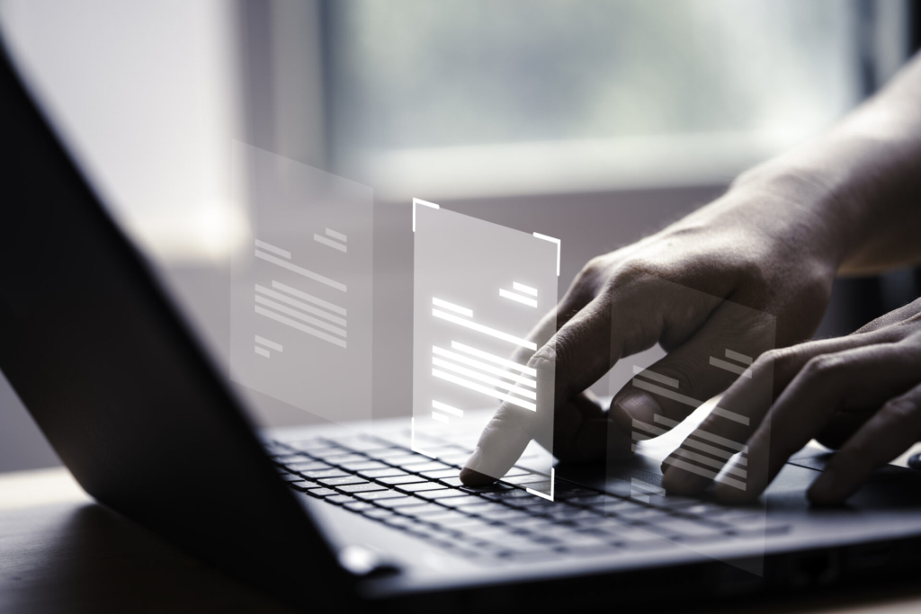 hand using laptop computer with virtual screen and document for